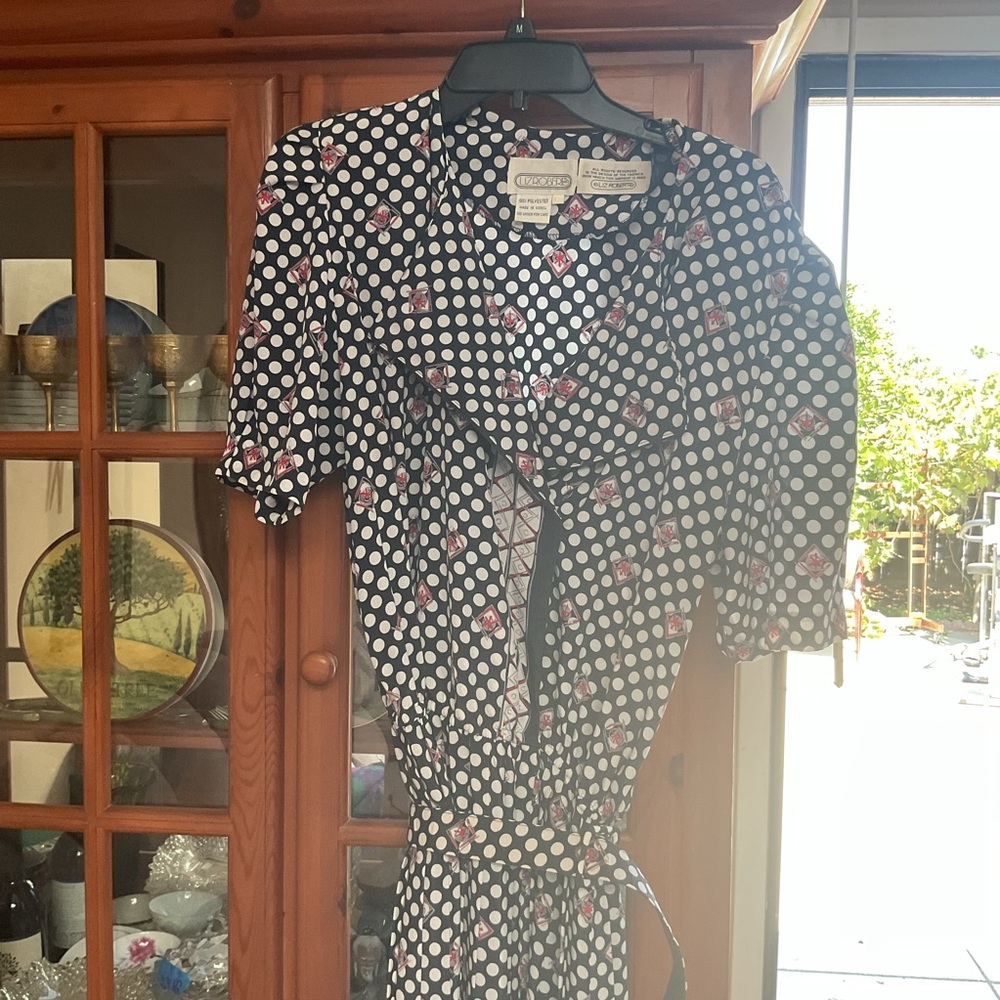 Stylish Black and White Polka Dot Dress with Pink Floral Design